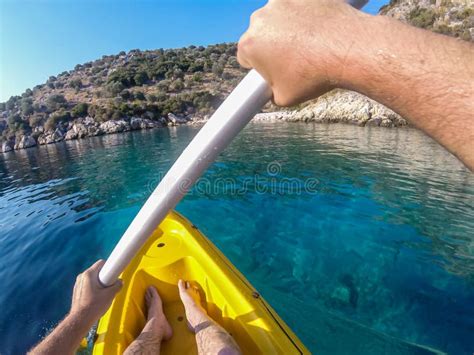 Colorful Yellow Kayak At Blue Sea Water During Summer Vacation Stock