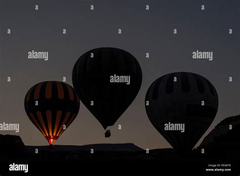 Silhouettes Of Four Hot Air Balloons In Sunrise Stock Photo Alamy