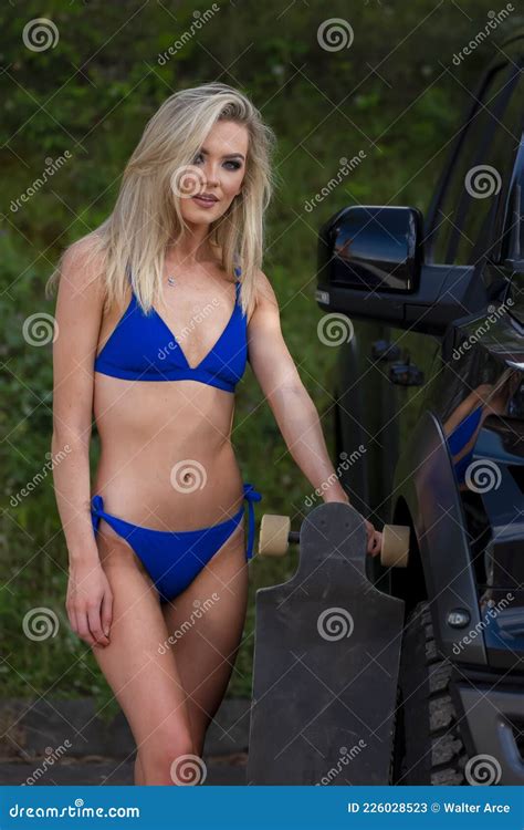 A Lovely Blonde Bikini Model Poses Outdoor While Enjoying A Summers Day Stock Image Image Of