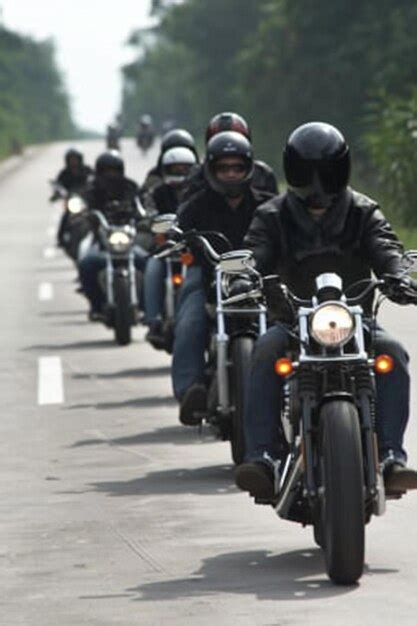 Premium Photo A Group Of People Riding Motorcycles Down A Road