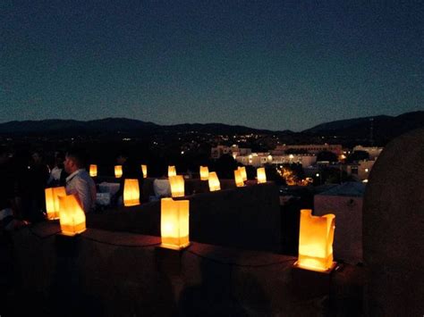 A Dreamy Shot Of Farolitos Luminarios And Santa Fe As Seen From The