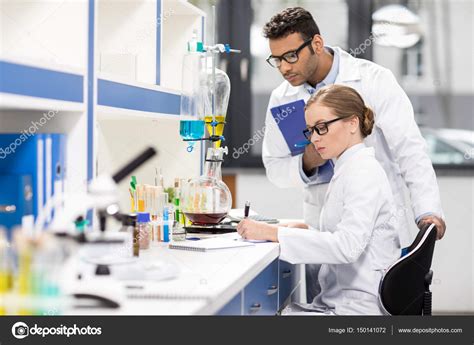 Scientists Working In Laboratory — Stock Photo © Alexfedorenko 150141072