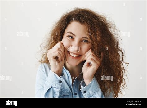 Portrait Of Beautiful Cheerful Redhead Girl With Curly Hair Smiling