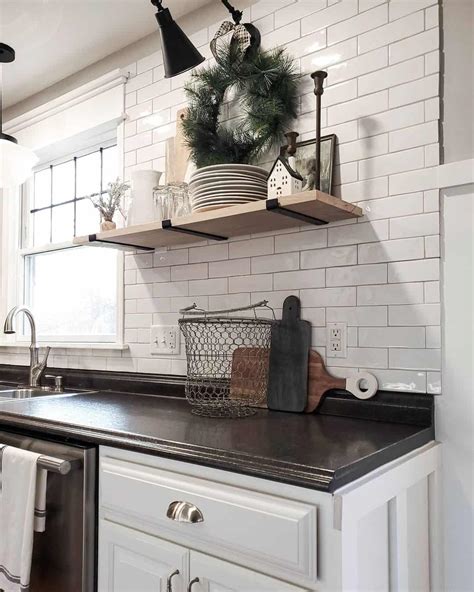 White Subway Backsplash And Black Kitchen Counter Soul Lane