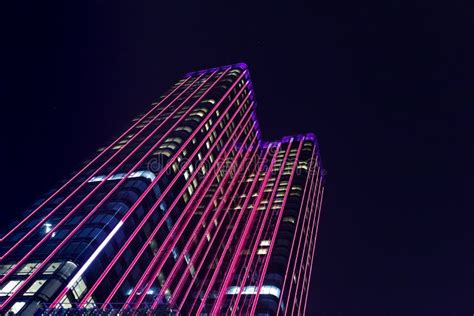 Skyscraper Illuminated With Colorful Led Lights At Night In Saigon