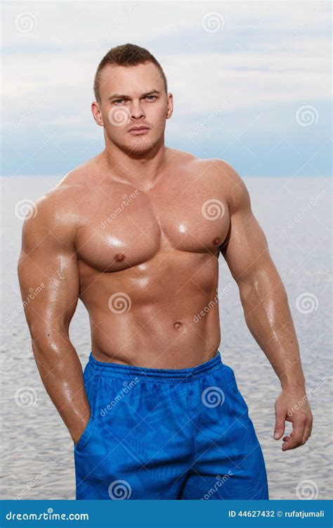 Bodybuilder On The Beach Stock Photo Image Of Background