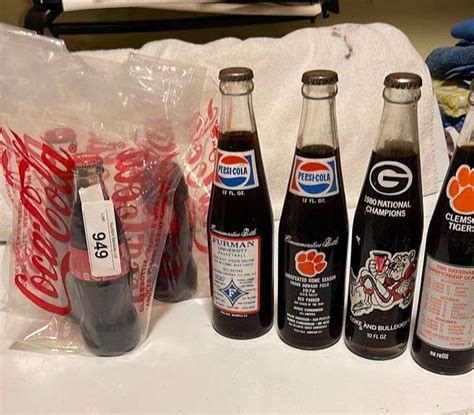 Coke and Pepsi Bottles - Auction Services LTD