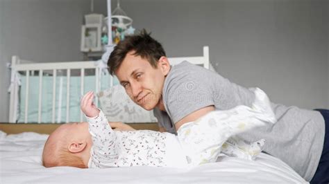 Tired Father Sits Near Newborn Girl Waiting Baby Calms Down Stock Photo