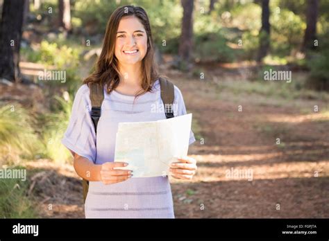 Pretty Brunette Hiker With Map Smiling Stock Photo Alamy