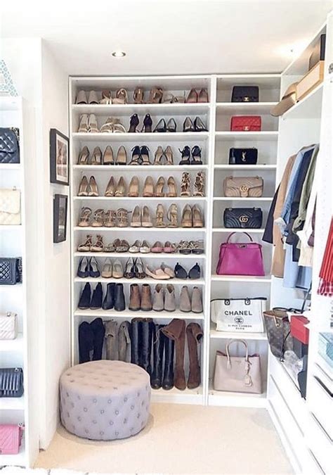 A Closet Filled With Lots Of Shoes And Purses Next To A Wall Mounted