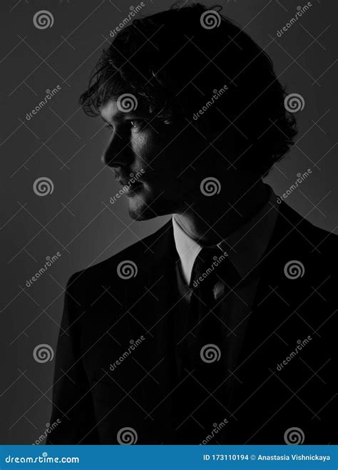 Handsome Charismatic Man Looking Serious In Dark Shadow Dramatic Light