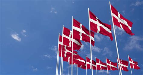 Denmark Flags Waving In The Sky Seamless Loop In Wind Space On Left