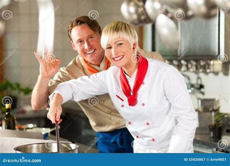 Chefs In A Restaurant Or Hotel Kitchen Cooking Stock Image Image Of