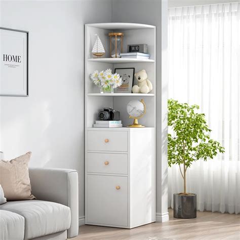 A Living Room With A Couch Chair And Bookshelf