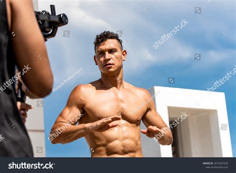 Muscular Man Fitness Influencer Recording Exercise Stock Photo