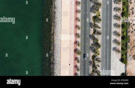 Coastal Road With Palm Trees And Running Track In Marjan Island In Ras