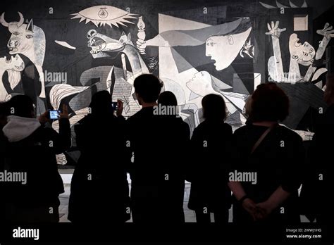 Visitors Watching The Guernica Oil Painting By Spanish Artist Pablo