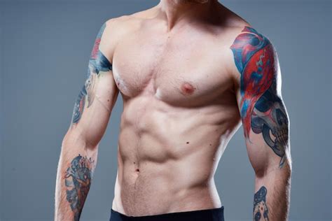 Premium Photo Athlete With Cubes On His Stomach Press Pumped Up Torso Muscles Tattoos Nude