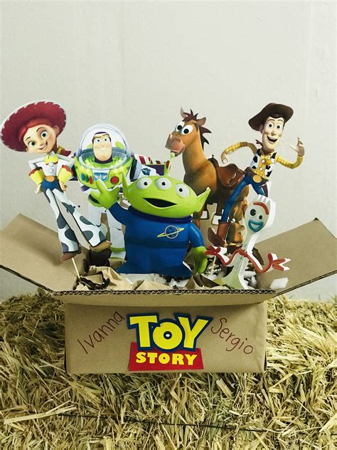 Toy Story Figures In A Cardboard Box On Hay