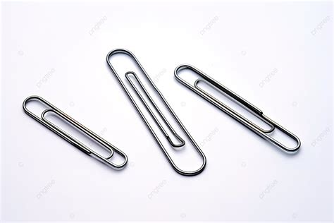 A Collection Of Three Paper Clip Shapes Laying On A White Surface Background, Missing, Variety ...