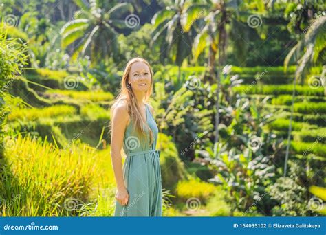 Beautiful Young Woman Walk At Typical Asian Hillside With Rice Farming