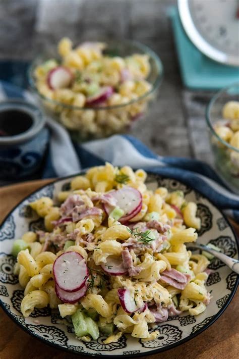 Pasta Salad With Radishes And Onions In A Bowl On A Wooden Table Top