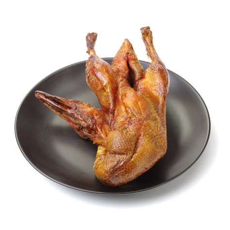 Whole Roast Duck with Crispy Skin Stock Photo - Image of background ...