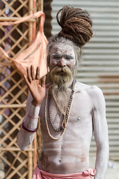 A Hindu Priest Applying Forehead Markings At The Kumbha Mela In India