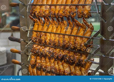 Crispy Golden Roasted Chicken Wings on Grilling Machine Stock Photo ...