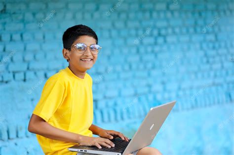 Premium Photo Indian Child Using Laptop At Home Attending Online Classes