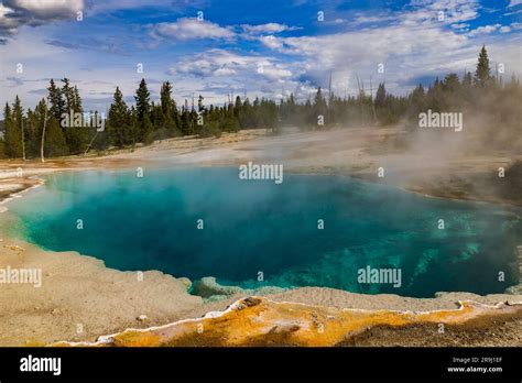 Steam Rises Off The Turquoise Colored Water Of Black Pool Hot Spring In