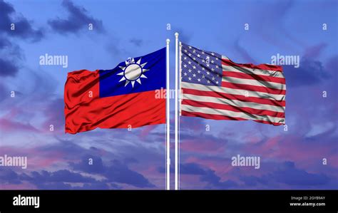 Taiwan And United States Two Flags On Flagpoles And Blue Sky Stock