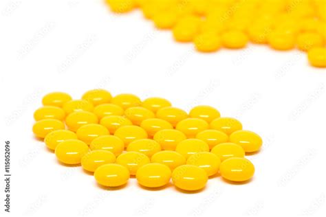 yellow sugar coated tablets pills Stock Photo | Adobe Stock