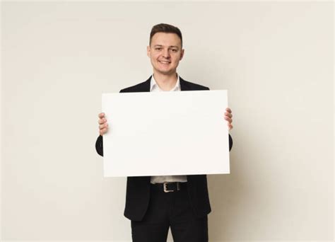 28300 Man Suit Holding Sign Stock Photos Pictures And Royalty Free