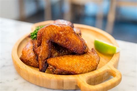 Premium Photo Deep Fried Chicken Wing On Wooden Plate