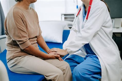 Premium Photo Doctor And Senior Female Patient Who Lie On The Bed