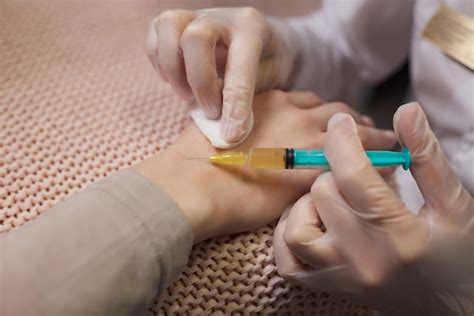 Premium Photo Doctor Doing Stem Cell Therapy On A Patients Elbow