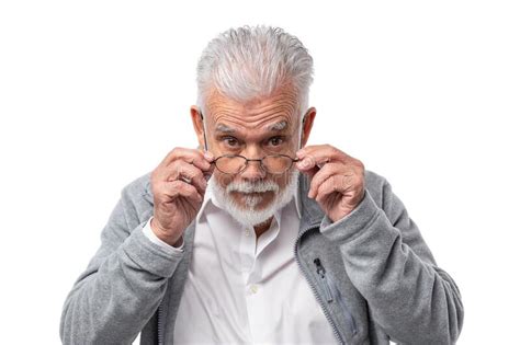 An Elderly Stylish Man In Glasses With A Beard And Gray Hair Looks From