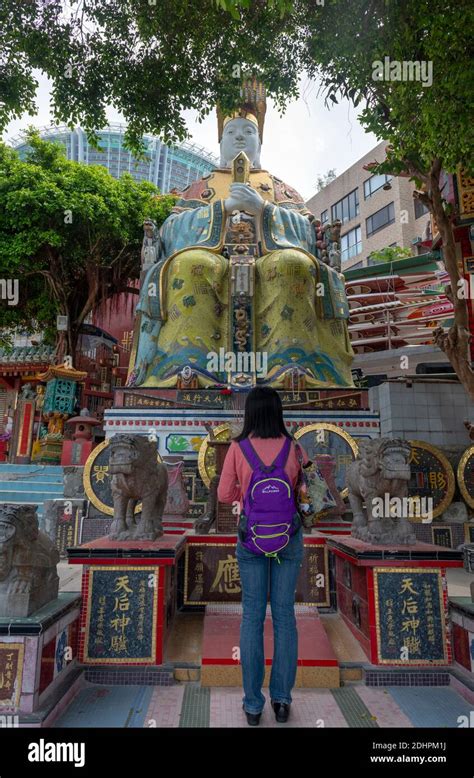 Girl Worships Tin Hau Statue Goddness Of The Sea In Tin Hau Temple