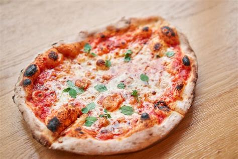 Baked Tasty Margherita Pizza In Traditional Wood Oven In Naples