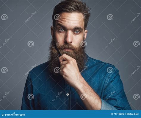 Bearded Man In Blue Denim With Serious Expression Stock Image Image