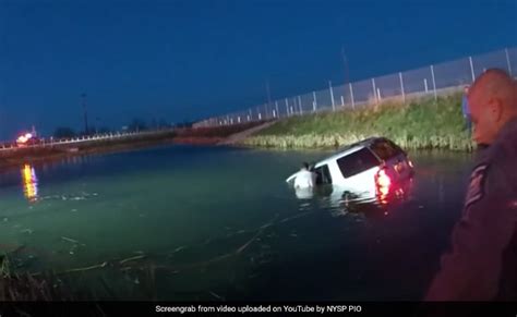 Watch Body Camera Footage Shows Us Cops Rescuing Woman Trapped In