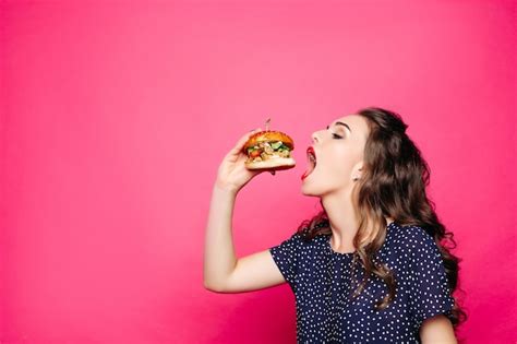 Premium Photo Hungry Girl With Opened Mouth Eating Big Hamburger