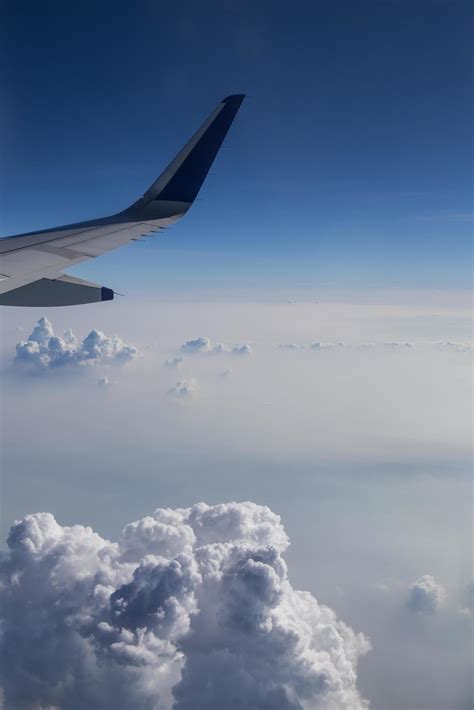 View of clouds from a airplane window 9637738 Stock Photo at Vecteezy