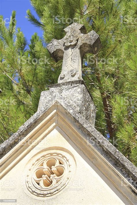 Tombstone With Cross Ornament At A French Cemetery Stock Photo