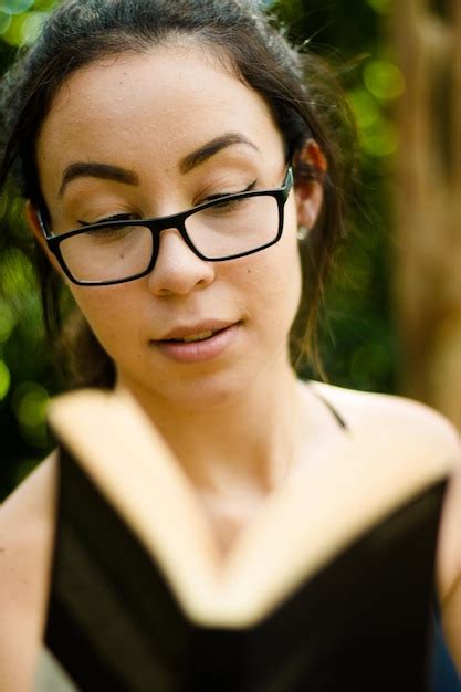 Premium Photo Beautiful Woman Reading Book On Field