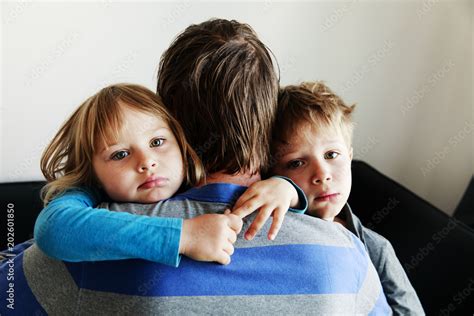 sad little boy and girl hugging father, family in sorrow Stock Photo ...