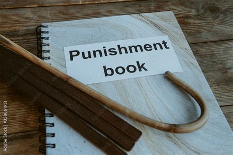 Punishment Book Leather Tawse And Cane For Spanking On Headmasters Or