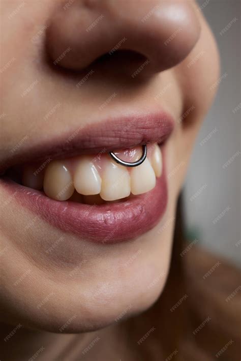 Premium Photo Smile Or Frenulum Piercing Under The Upper Lip