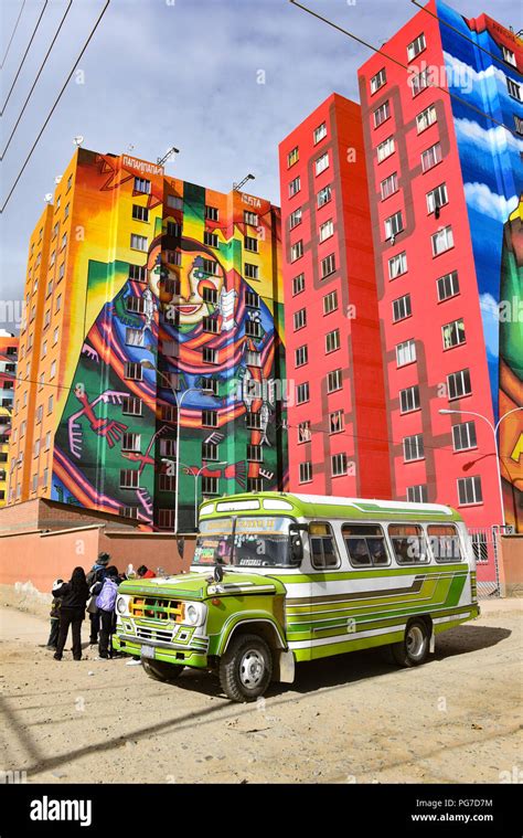 Brightly Colored Murals Painted By Bolivian Artist Roberto Mamani Mamani Onto Condominium